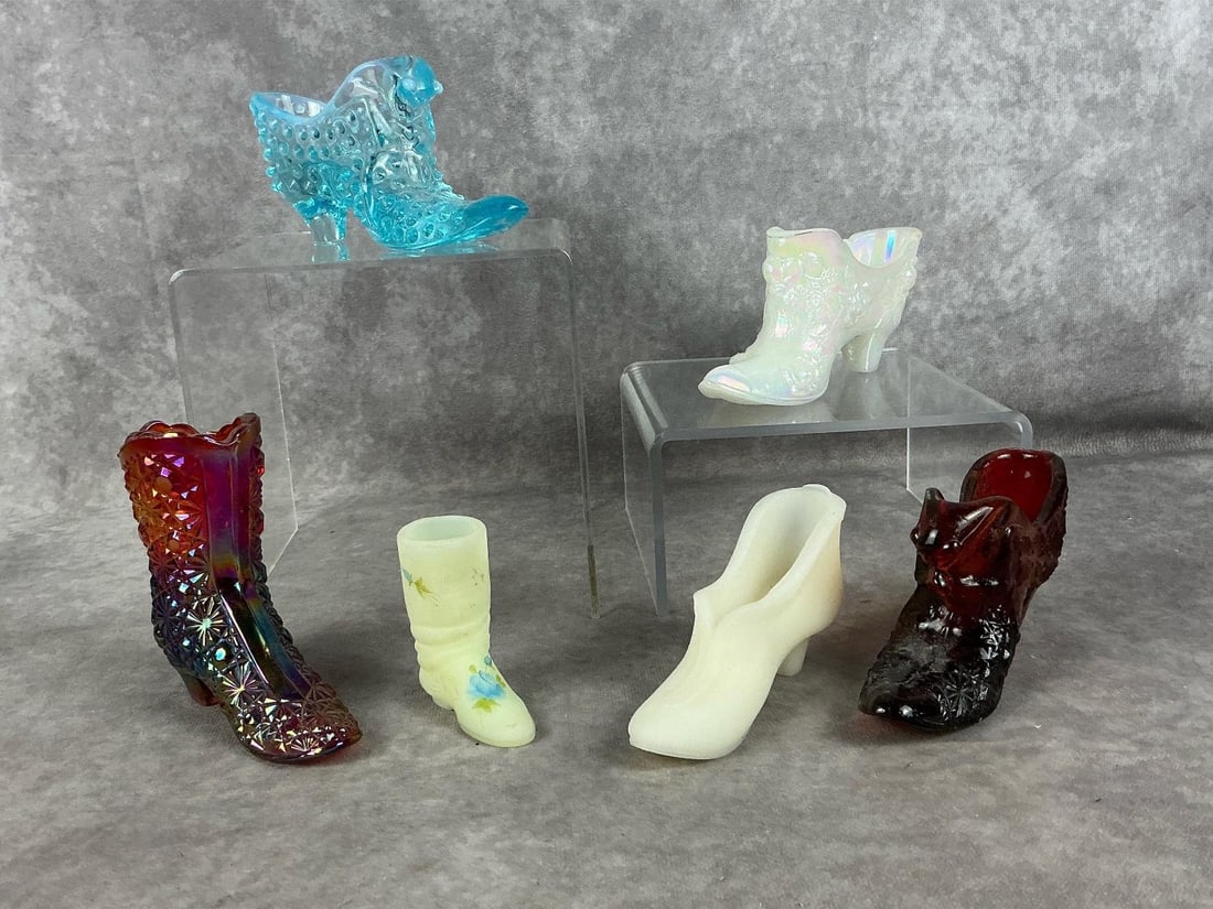 Art Glass Shoes: Six Mid 20th century assorted art glass with one uranium glass piece. One Fenton art glass iridescent carnival glass daisy and button boot with Fenton logo on bottom. One unmarked Fenton cat head oran