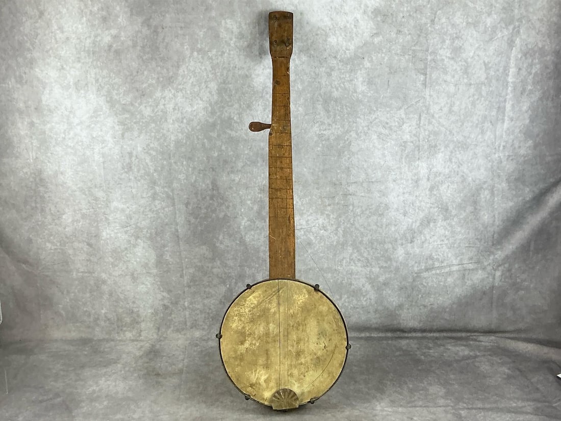 Appalachian Homemade Banjo: Circa 1900 Appalachian five string fretless banjo. Four mismatched friction tuning pegs on a rectangular peg head, head tightening system consisting of six hooks, nuts, and brackets, and made without