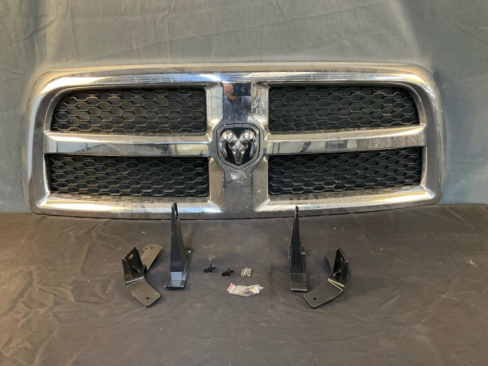 Dodge Ram Grille: Chrome and black honeycomb mesh grille. Fits 1994 through 2002 Dodge Ram 1500/2500 and 3500. Used, and dirty otherwise in good condition. Box measures 54 inches long x 19 inches wide and 6 inches high