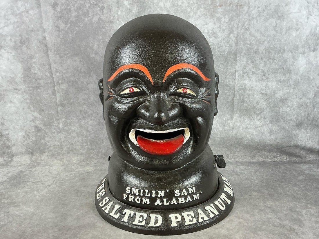 Smilin' Sam Bank: Large cast iron Black Americana Bank "Smilin' Sam from Alabam". Modeled after a 1930s peanut dispenser. In good condition. Measures 10 inches in diameter at base x 13 inches tall.