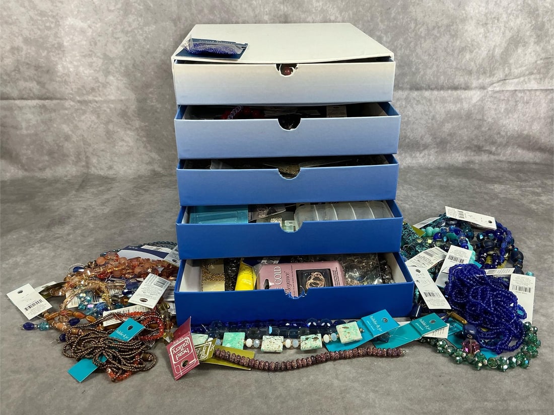 Craft Bead Supply: Five drawer box filled with bead craft supplies. Includes a large amount of glass, stone, metal, and plastic beads. Also includes jewelry accessories. Good condition. Box measures 19 inches wide x 12