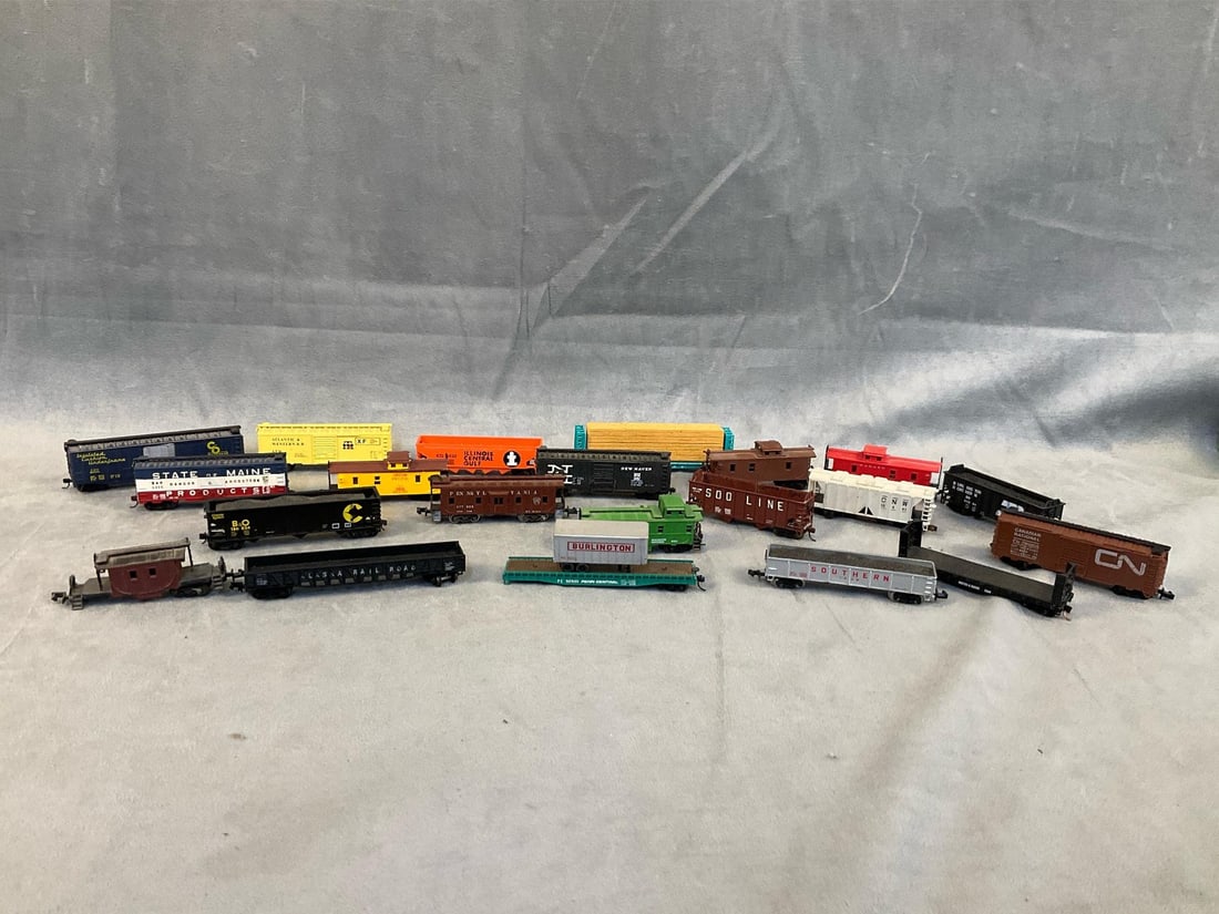 Model trains: 1960’s - 1970’s train cars. Twenty one total cars. Some made in China, Austria, and West Germany. Some with broken, missing, and loose parts. State of Maine boxcar measures 3.25 x .75 x 1 inch