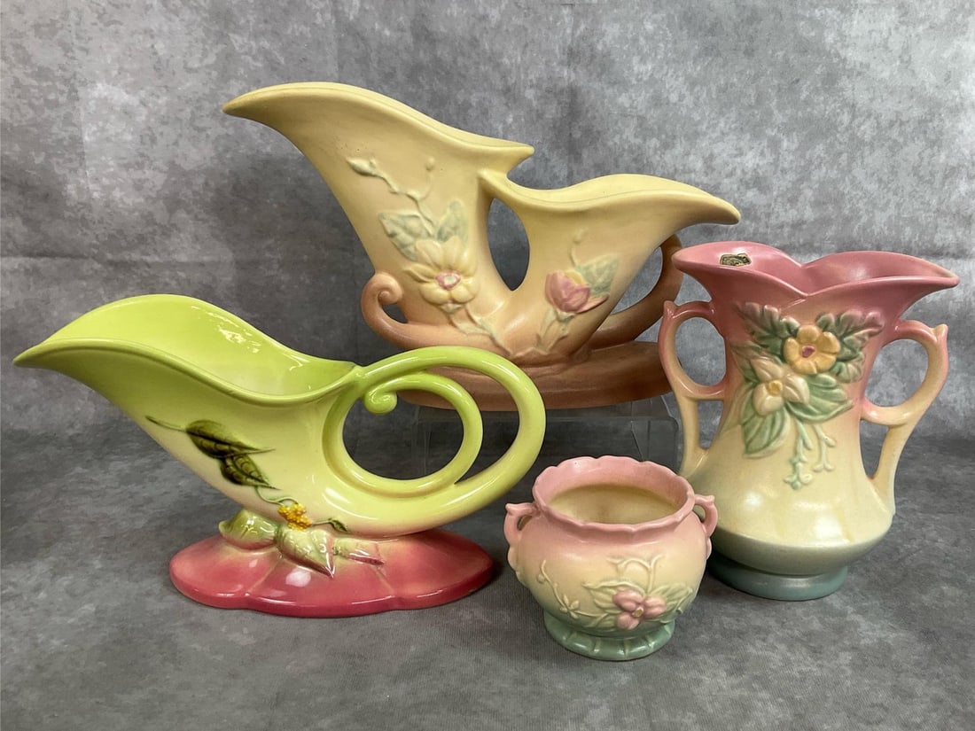 Hull Cornucopia & Floral Vases: Four mid to late century vases. Hull Art pastel matte pieces and a chartreuse and pink glazed vase. Two are cornucopia style, a tall vase and a small vase featuring woodland pattern and wildflower