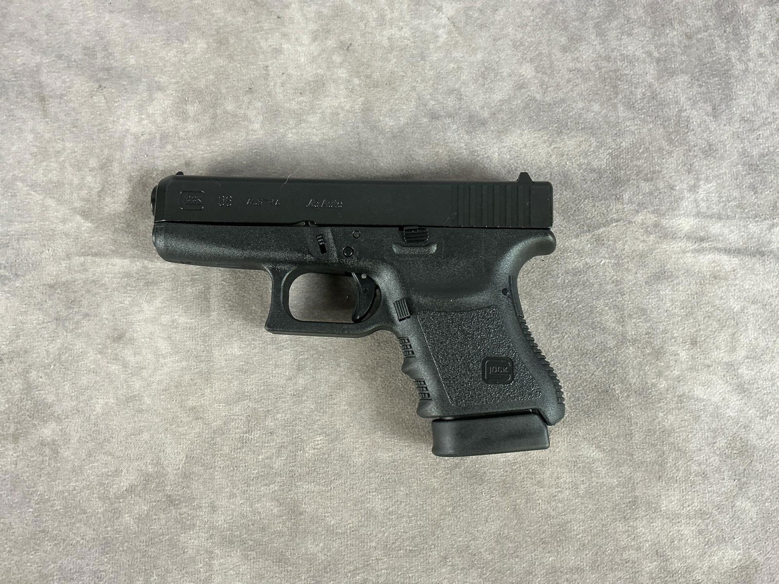 Glock Model 36 45 Auto Pistol: Serial # LWW496 Clean bore. Looks to be unfired and in good condition. Includes hard plastic box and one extra magazine. Barrel length 3.5 inches, overall length 7 inches.