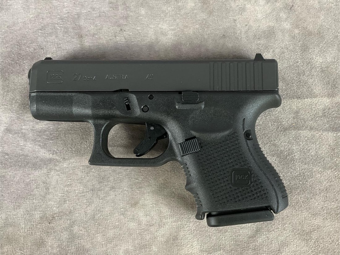 Glock G27 GEN 4, 40 Caliper Pistol: Serial # XLE 838. Clean bore and in good condition. Includes plastic case, two extra magazines, cleaning brush and jag. Barrel length 3.25 inches, overall length 6.5 inches.