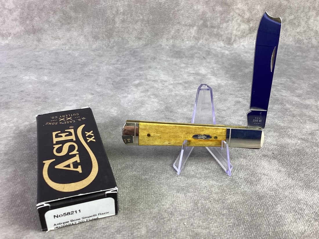 Case XX Knife Antique Bone: Case XX antique bone smooth razor fluted knife. Tight snap and unsharpened, patterned number 61005RAZ ss. Comes in original box and closed measures 3.75 inches.