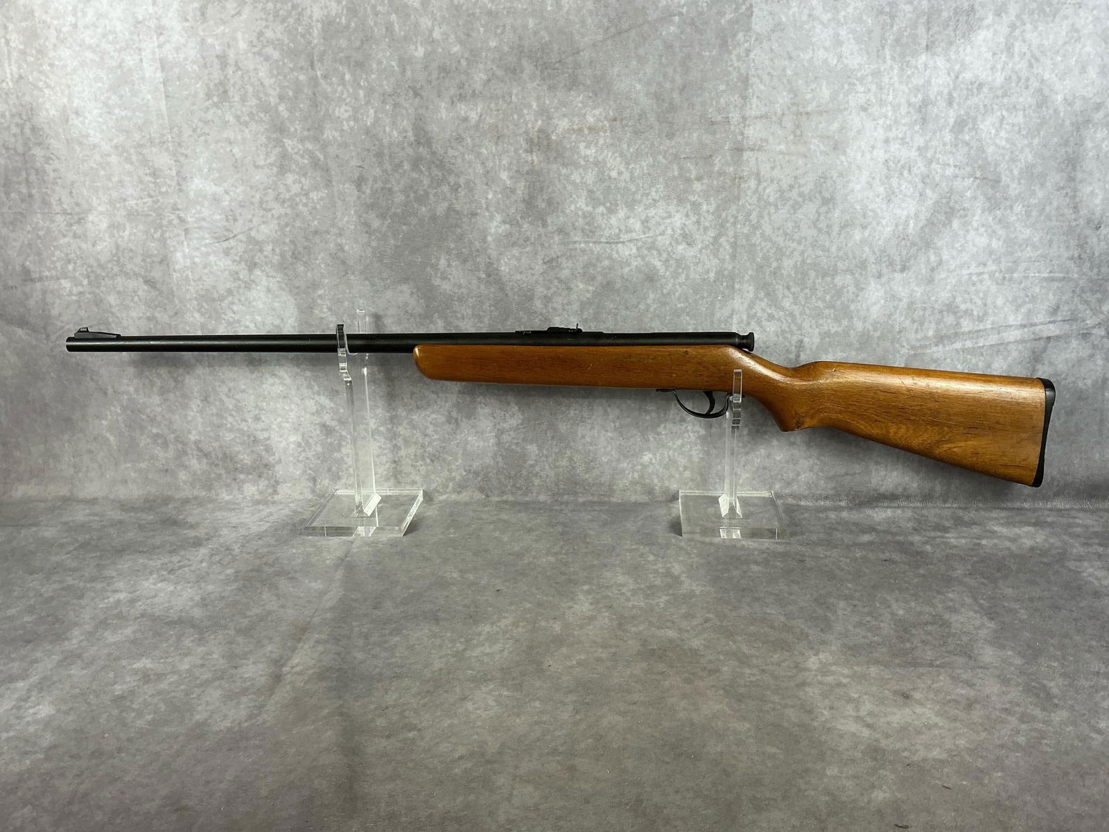 Western Field 22 S,L,LR Rifle: Serial # NV Model XNH 806 single shot. Barrel has scratches, stock is scratched and marred. Barrel length 21 inches, overall length 38 inches.