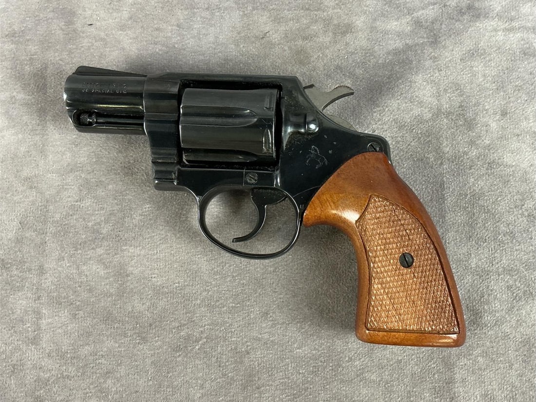 Colt Detective Special 38 Special Revolver: Serial # B36781. Clean bore and cylinder. In good condition for its age. Leather holster included. Barrel length 2 inches, overall length 7 inches.