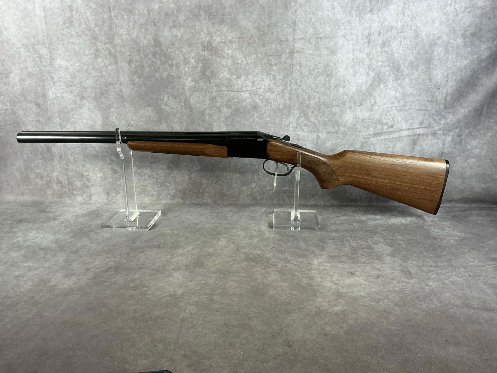 Stoeger Double Barrel 12 GA Coachgun: Serial # 549861-06 Clean bore and in good condition. Light scratching on metal parts and stock. Barrel length 20 inches, overall length 36.5 inches.