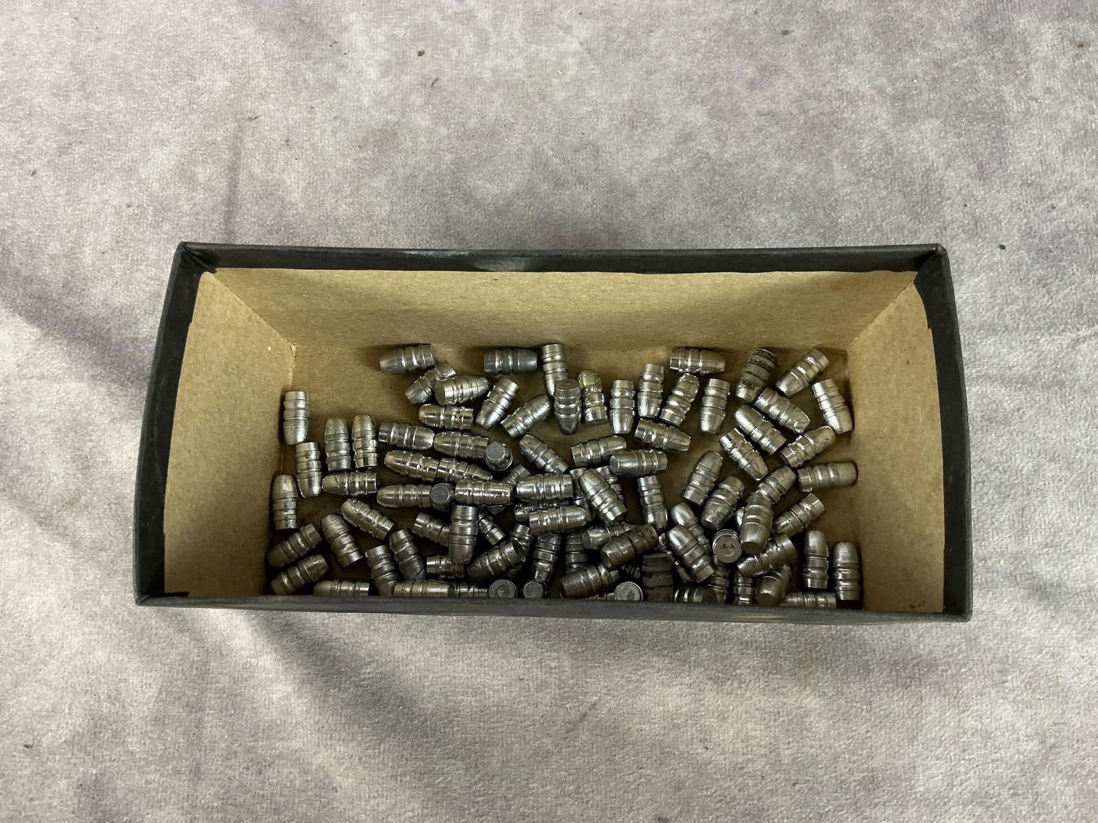 .303 British Hand Cast Bullet: 85 total 100 GR .312 Dia. Semi-wadcutter bullet. Box measures 7 inches long X 3 inches wide X 3 inches high.