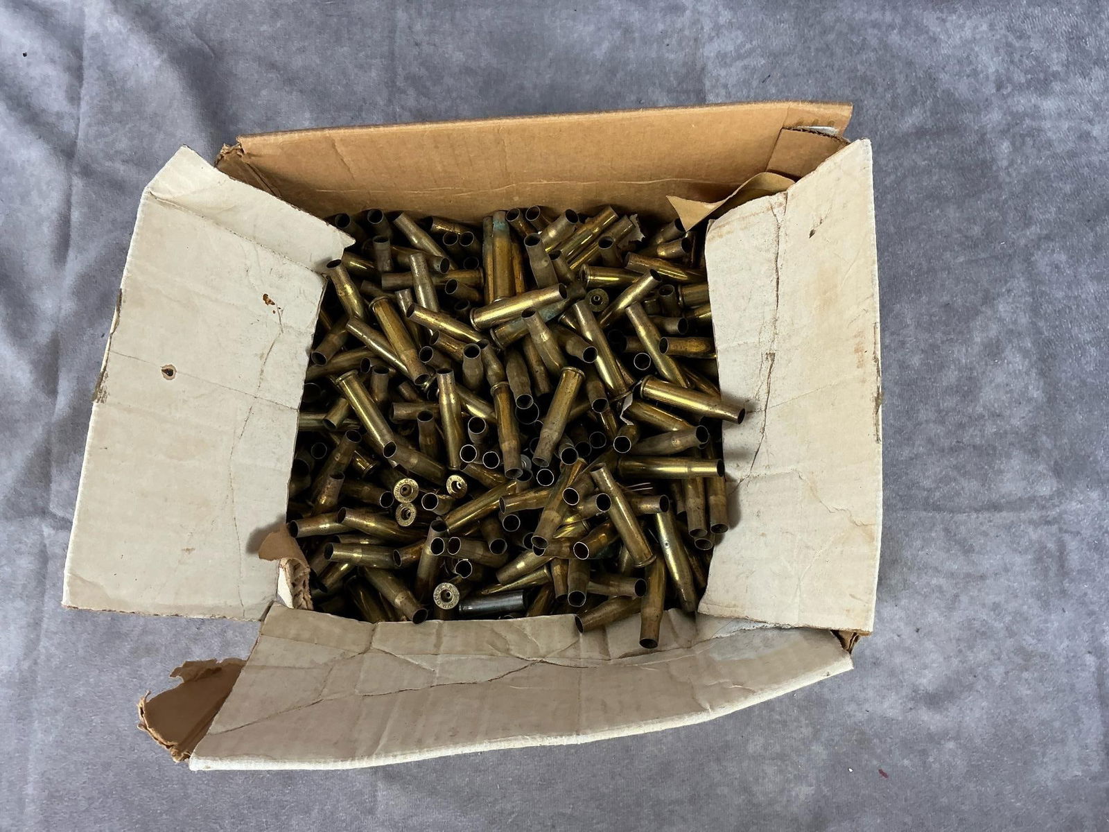 Remington-Peters 30-30 Winchester Brass Casings: 100 total. Used casings. Box measures 11 inches long X 8 inches wide X 6 inches high.