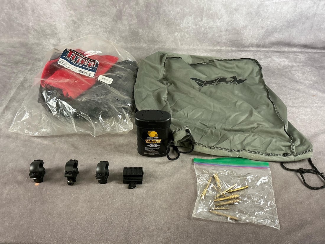 Lot of Shooting Acceseries: Tuff gun ammo bag, scope rings and base, cleaning wipes, cleaning jag and bag. Largest item measures 13 inches long X 10 inches wide X 5 inches high.