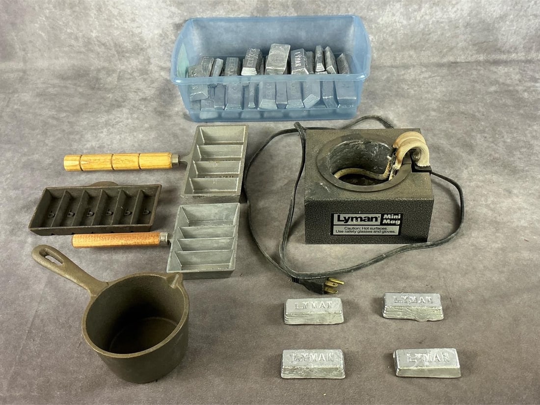 Lyman Bullet Casting Setup: 1 lot as pictured. Mini Mag casting furnace. Includes casting molds and lead ingots. Largest item measures 6.5 inches X 6 inches wide X 5 inches high.