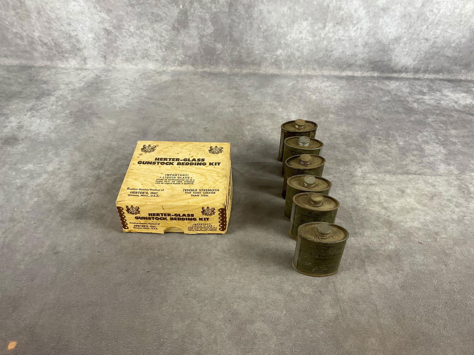 Herter’s Bedding Kit and Bore Cleaner: 1 lot seven items. Vintage gunstock glass bedding kit and six cans of bore cleaner. Box measures 5.25 inches long X 5 inches wide X 2.25 inches high.