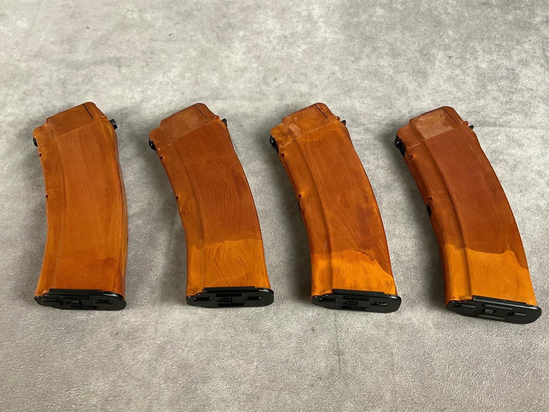 AK 74 Magazines and Pouch: 1 lot of five items. East German bakelite magazines, and carring pouch. Look to be unused and in good condition. Largest item measures 10 inches long X 7 inches wide X 3 inches high.