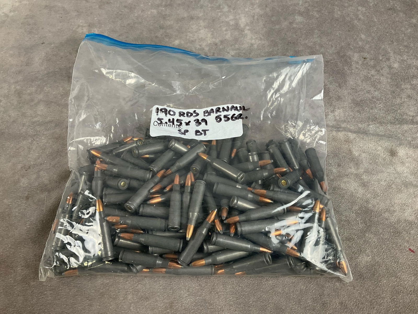 Barnaul 5.45 X 39 Ammunition: 190 total rounds. 55 GR soft point, boat tail. In good condition. Bag measures 10 inches long X 10 inches high X 2 inches high