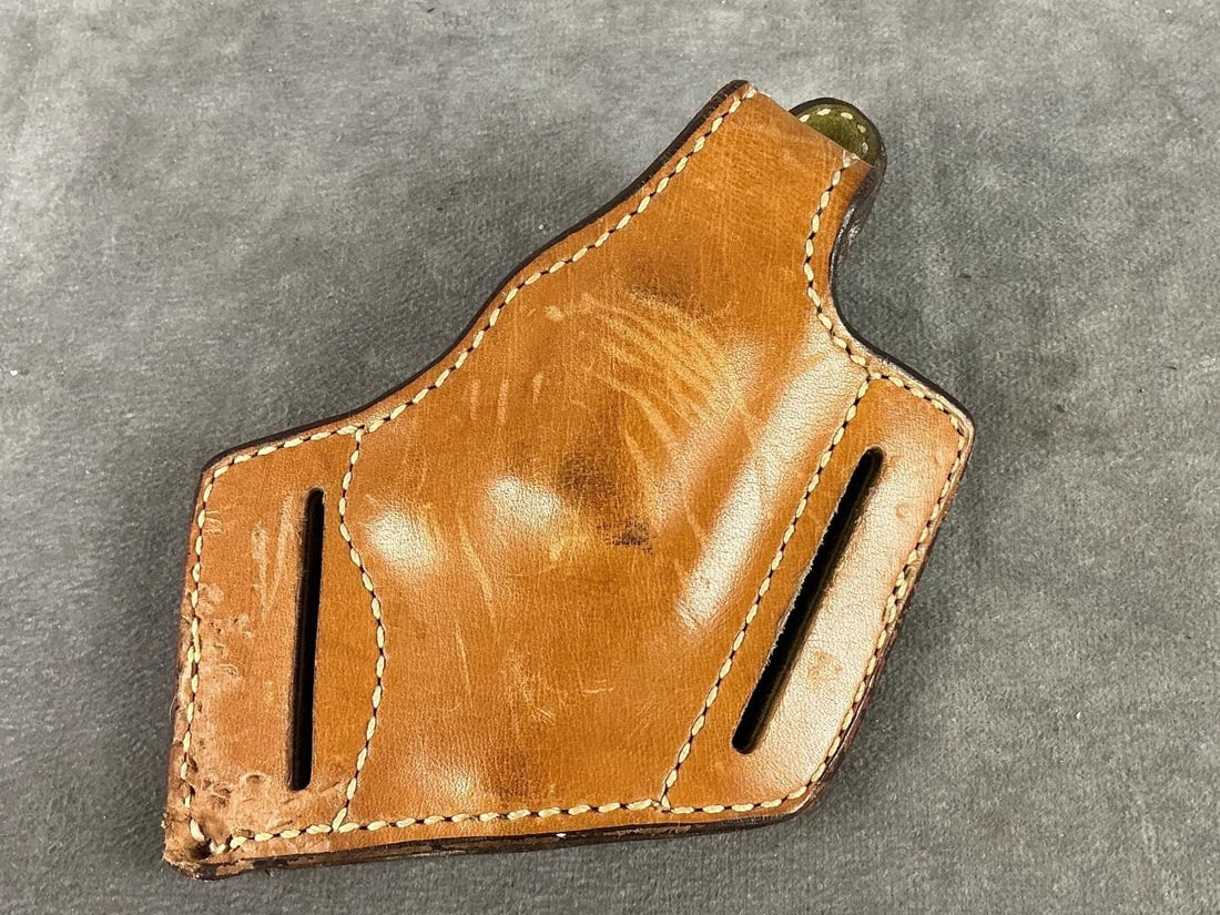 Safariland Leather Holster: Number 28 Used and in good condition. Measures 6 inches long X 5 inches wide X 1.5 inches high.