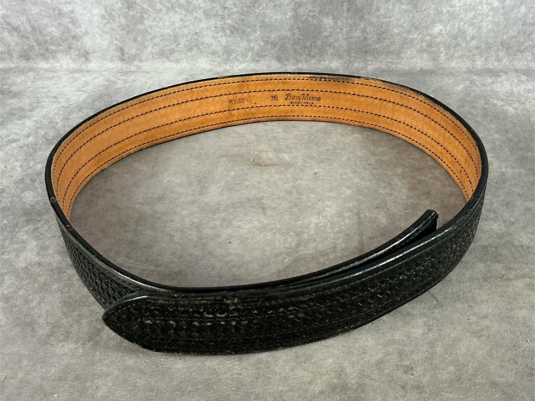 Don Hume Gun Belt: Hand tooled weave pattern. Size 36, velcro catch. In good condition. Measures 45 inches long X 2.25 inches wide.