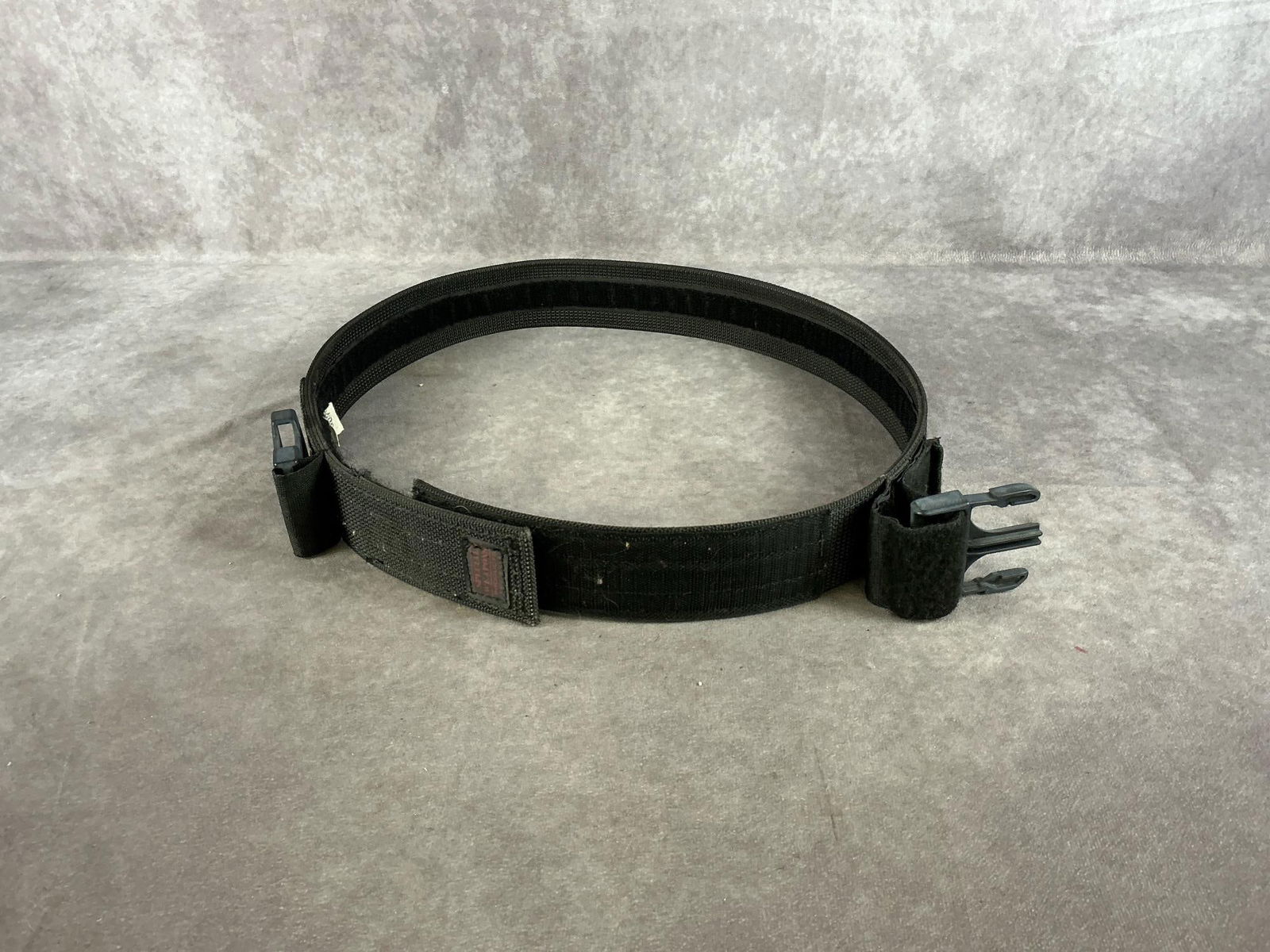 Special Weapons Products Gun Belt: Number 1307 synthetic. Tactical molle duty belt. Black, in good condition. Measures 45 inches long X 2 inches wide.