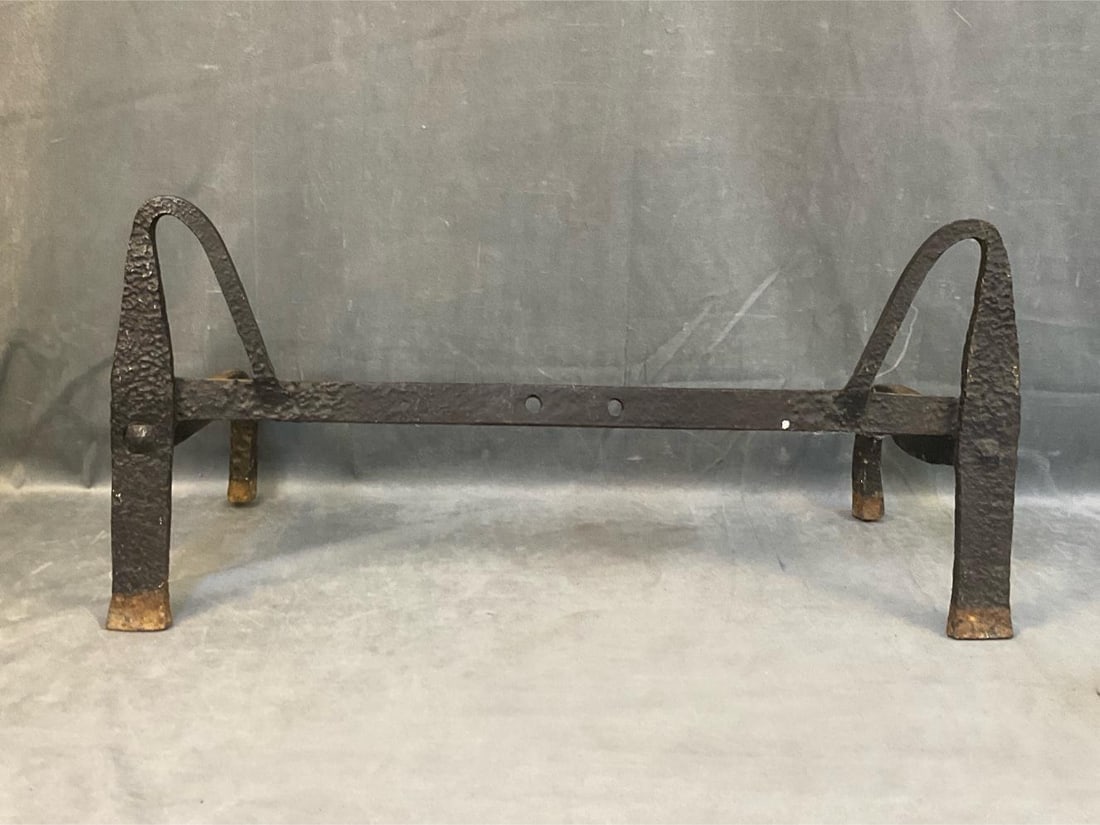 Hearth Andirons: Rare mid-18th century andirons with a wrought iron cross bar used as a skewer rest or spit for hearth cooking. Good condition. Found in Bedford County, Virginia. Measures 26.5 inches wide x 12 x