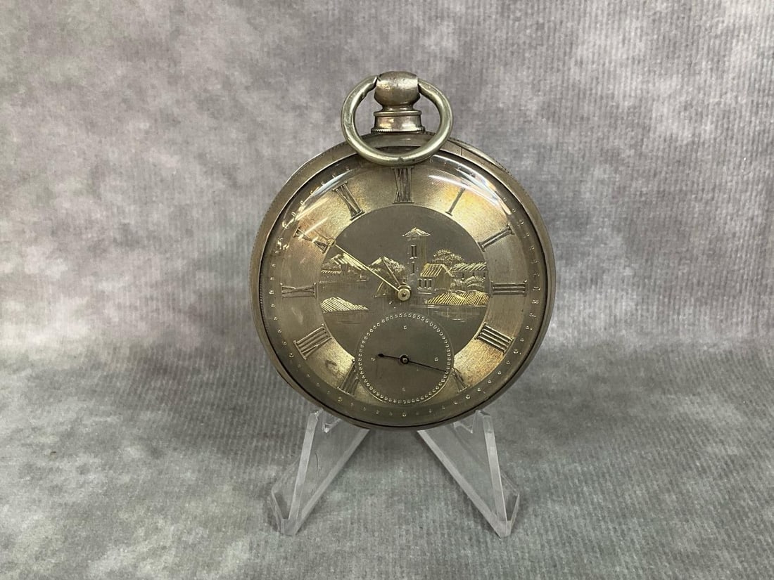 M.J. Tobias Pocket Watch: 1840's M. J. Tobias silver toned open face case with etched face. Outside movement cover etched Cylinder Escapement M.J.Tobias Liverpool Four Holes Jewelled. Serial number 11124. Watch is key wound,