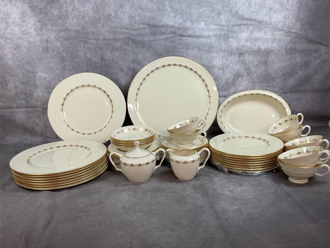 Lenox Romance Pattern China: Late 1900s china set. Romance pattern by Lenox E 501, ivory bone china with mauve rosebuds and gold trim. Includes platter, 8 dinner plates, 8 bread plates, 8 salad plates, 4 dessert plates, 9 cups an