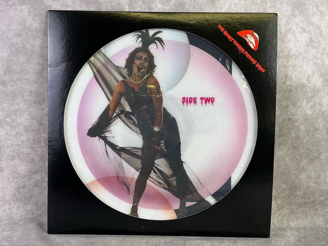 Rocky Horror Picture Show Vinyl: Original 1978 The Rocky Horror Picture Show soundtrack on vinyl. Comes in sleeve with plastic protective cover, some mild warping to vinyl. Album measures 12.25 inches wide x 12.25 inches tall.