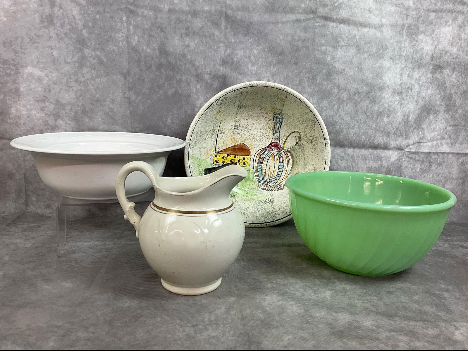 Fire King, Corning Ware, Capri, & More: Four mid to late century items. Fire King Jadite swirl mixing bowl, Capri by Royal Sealy wine and cheese serving bowl, and white Casual Elegance floral serving bowl by Corning Ware. Also includes