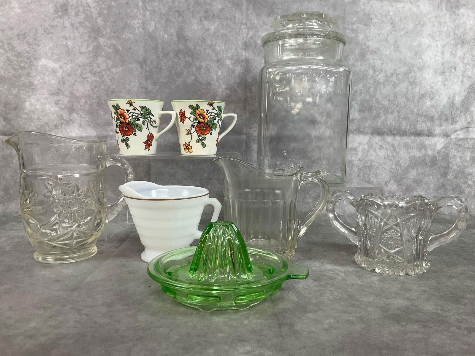 Apothecary Jar, Creamers, Uranium Juicer, & More: Eight early to mid century items. Anchor Hocking glass apothecary jar with knob lid, AH Precut Star of David cream pitcher, Colonial cream pitcher, and Hazel Atlas white creamer with gold stripe.