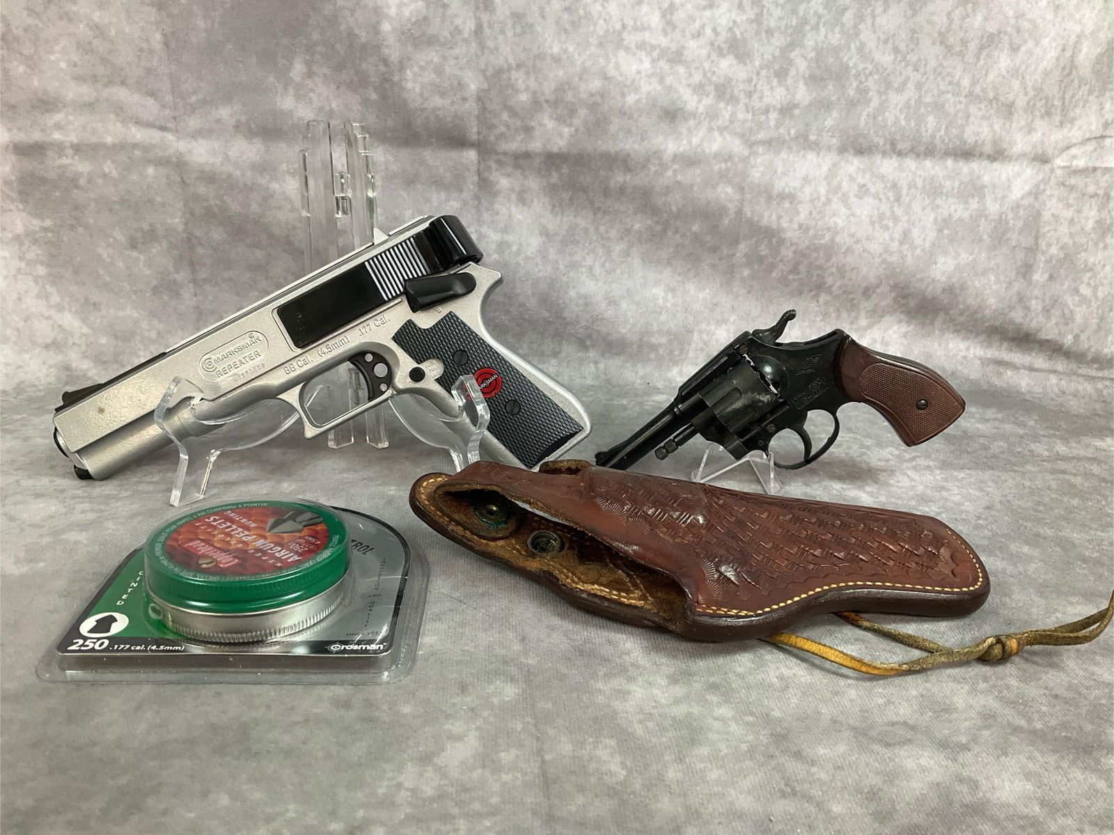 Pellet Gun, Mondial 22 Handgun, Pellets, & Holster: Vintage guns, holster and pellets. Vintage small 98x caliber 22 Mondial gun. Marksman Repeater pellet gun .177 caliber and Copperhead airgun pellets 250 count. Includes S & W leather holster Branch
