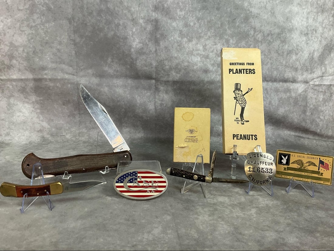 Collectible Knives, Boxes, & More: Eight early to mid 1900s collection. Stainless steel with wooden handle folding hunting knife, metal and wood Proto knife, and Boker pocket knife. Includes Case belt buckle, Planters Mr Peanut box