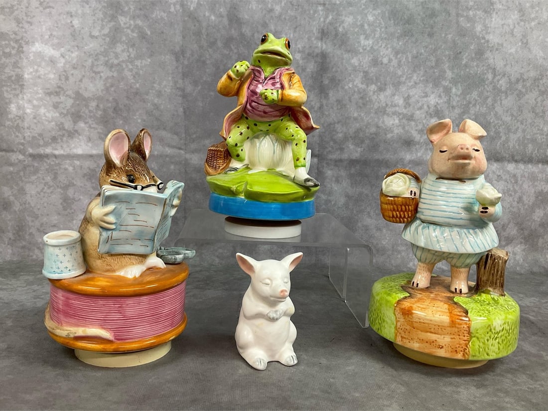 Beatrix Potter Music Boxes & Praying Pig: Three late 1900s animal music boxes and a pig figurine. Beatrix Potter series by Schmid revolving music boxes. Includes Little Pig Robinson, Jeremy Fisher, and Tailor of Gloucester characters.