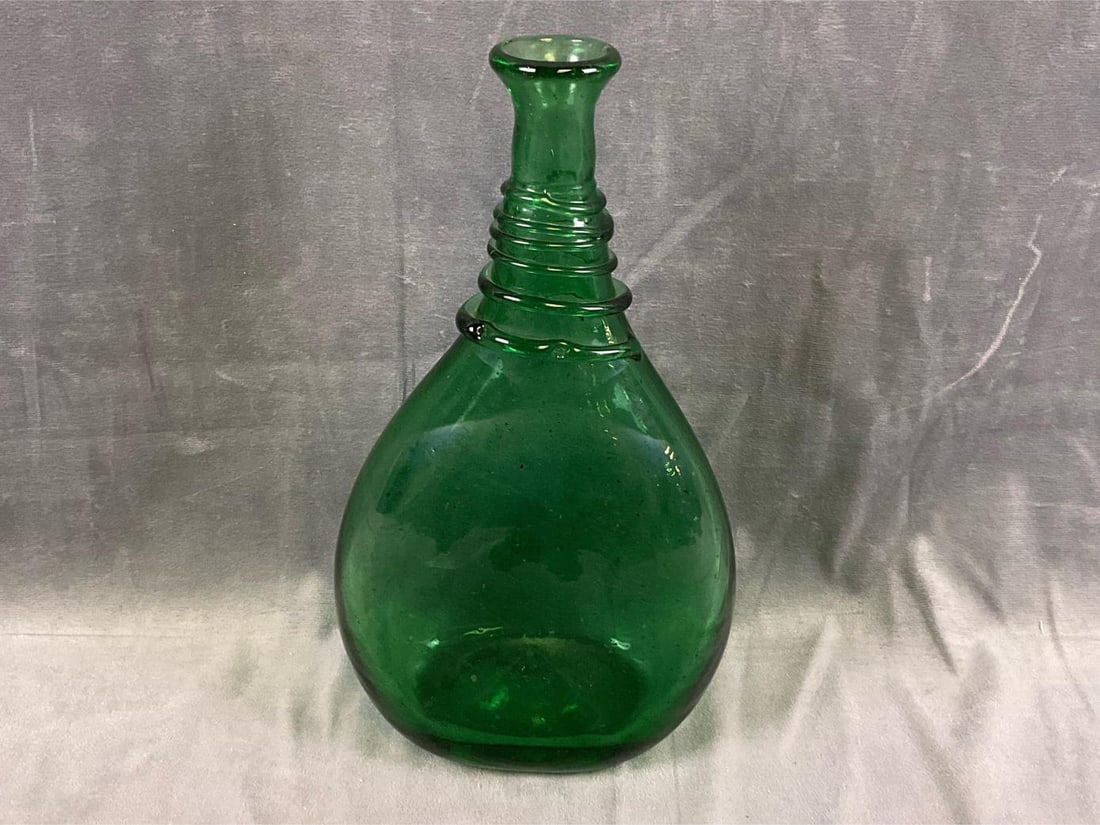 Persian Bottle: 18th -19th century Persian (probably Shiraz, Iran) camel-back hand blown flask with applied decoration on neck. Good condition. Measures 6.5 inches wide x 3.5 x 11.5 inches tall.