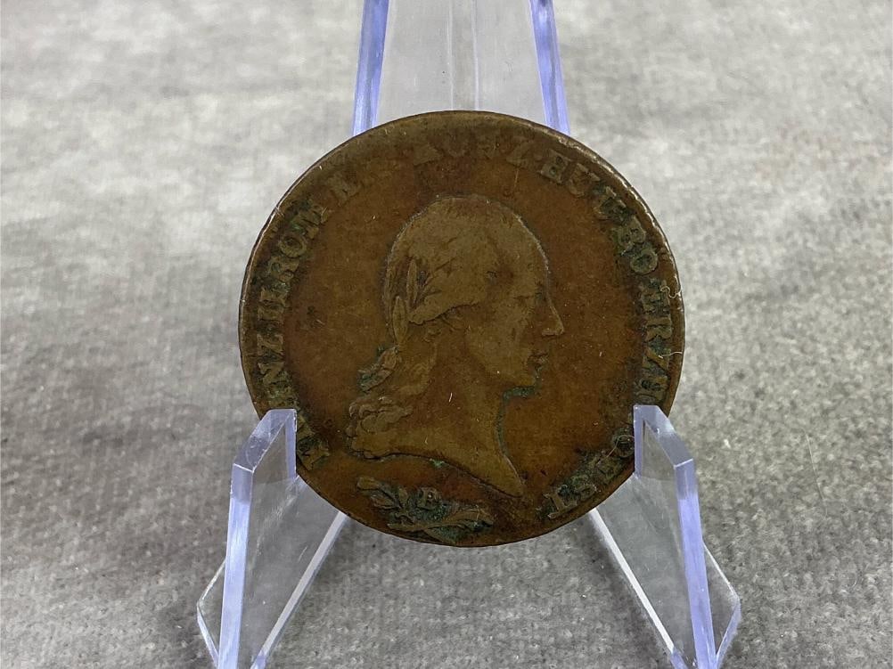 1800 6 Kruezer Coin: 1800 Austrian 6 Kreuzer coin featuring the laureate portrait of Frank II, the a Roman Holy Emperor. In good circulated condition. Measures 1.25 inches in diameter.