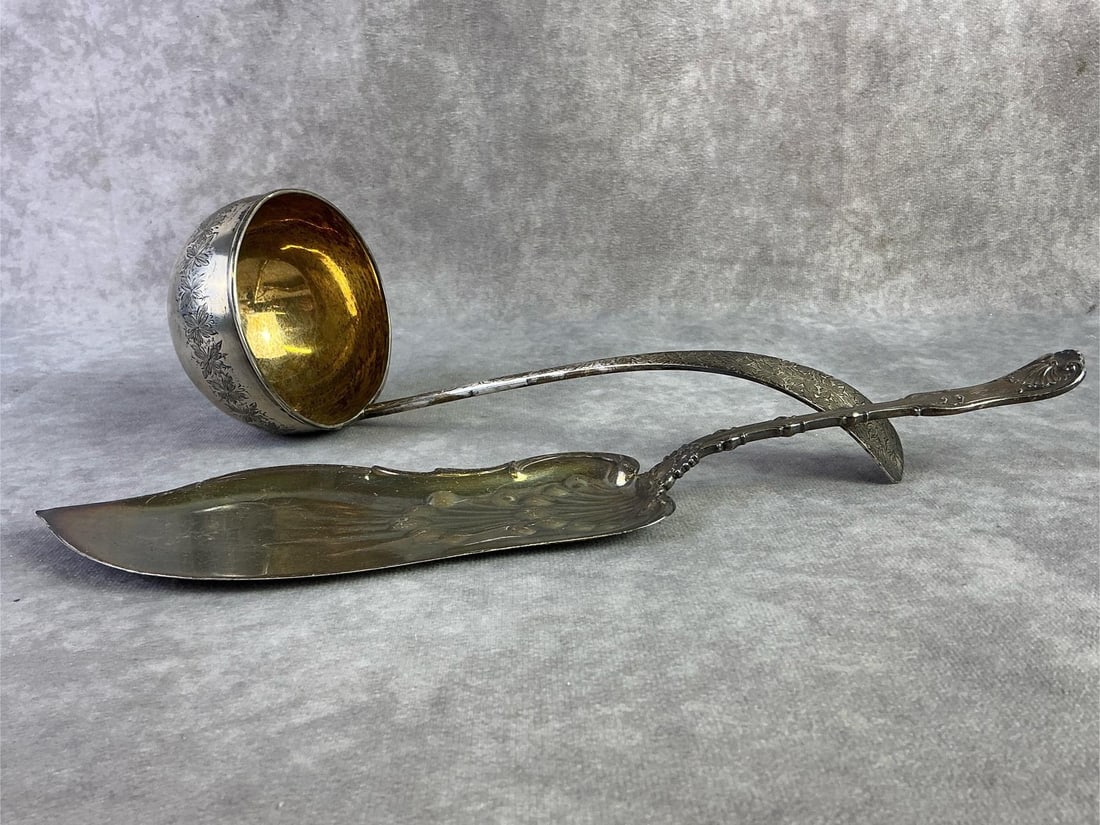 Sterling Silver Serving Utensils: Lot of two sterling silver serving utensils. Both in good condition, stamped with oxidation present. Total weight 9.54ozt.