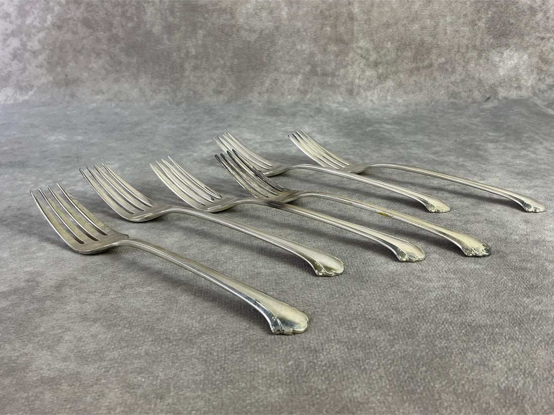 Towle Sterling Salad Forks: Lot of six Towle Sterling silver salad forks. All new old stock with original plastic, unsealed for weight purposes. Stamped and pattern Chippendale. Total weight 6.94ozt.