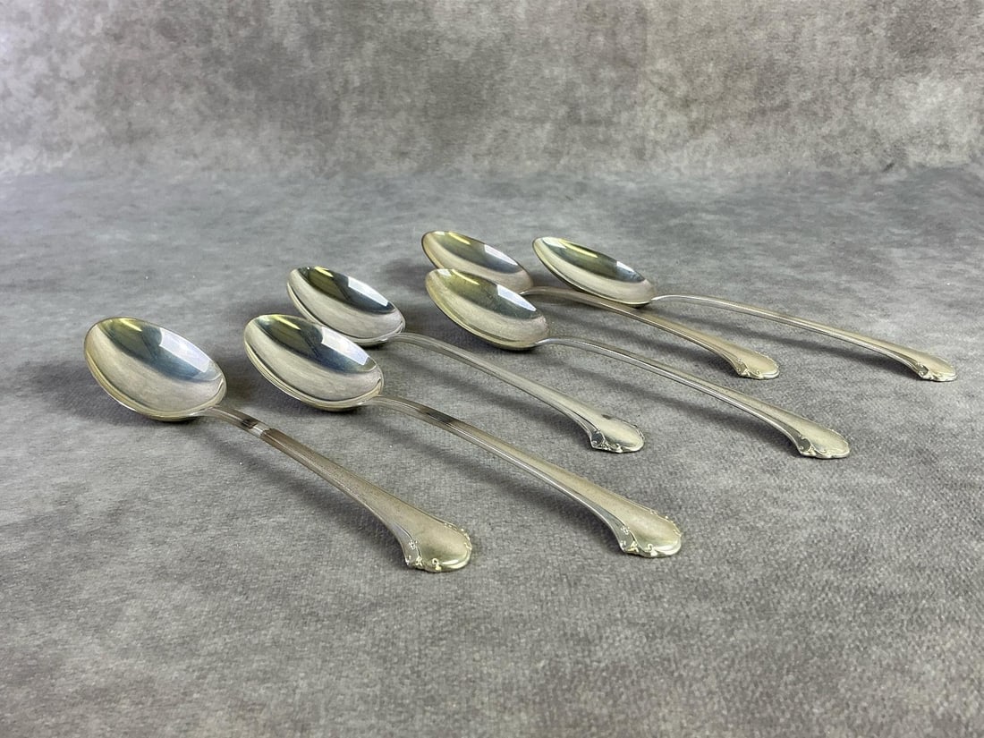 Towle Sterling Spoons: Lot of six Towle Sterling silver spoons. All new old stock with original plastic, unsealed for weight purposes. Stamped and pattern Chippendale. Total weight 4.97ozt.