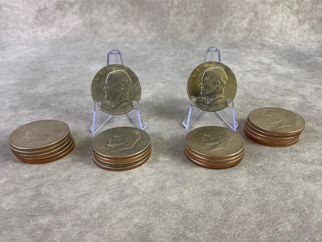 Eishenhower Dollar Coin: Lot of twenty 1976 Bicentennial Eisenhower dollar coins. All in good circulated condition. Each measures 1.5 inches in diameter.