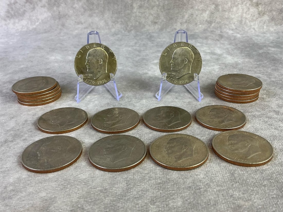Eisenhower Dollar Coins: Lot of twenty 1976 Bicentennial Eisenhower dollar coins. All in good circulated condition. Each measures 1.5 inches in diameter.