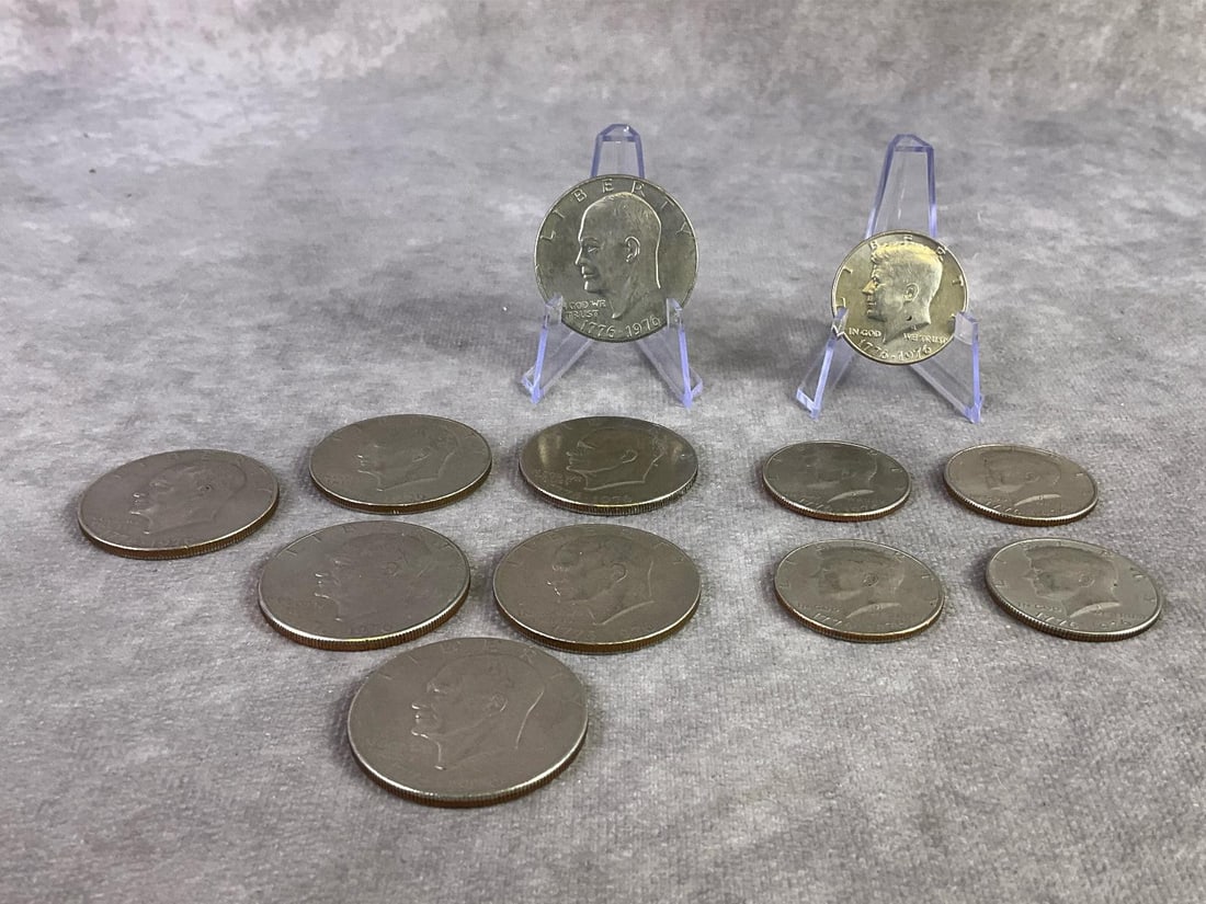 Eisenhower Dollars & Kennedy Halves: Lot of seven Bicentennial Eisenhower Dollar coins and five Kennedy half Dollar coins. In good circulated condition. Eisenhower measures 1.5 inches in diameter.