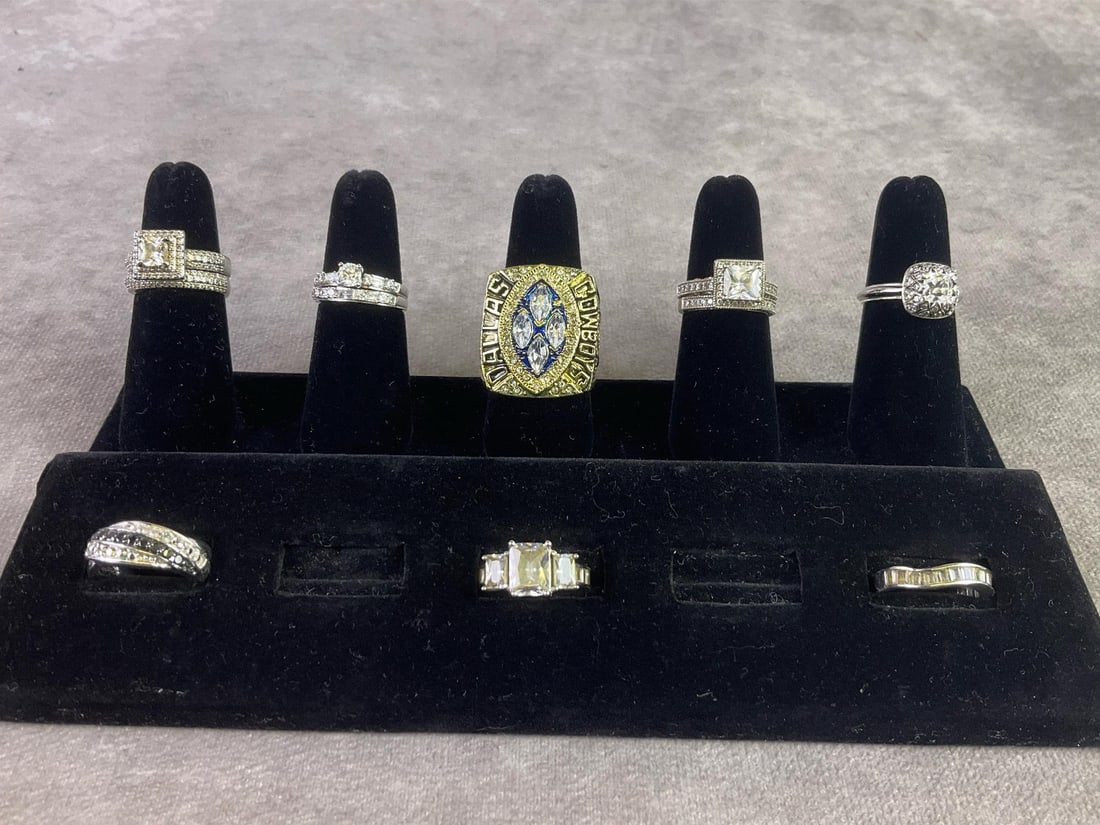 Ring Delight: Lot of eleven rings, two of which are sterling silver and stamped. All in good condition with woman's measuring 6.5 to 7 and men's ring measuring 10.