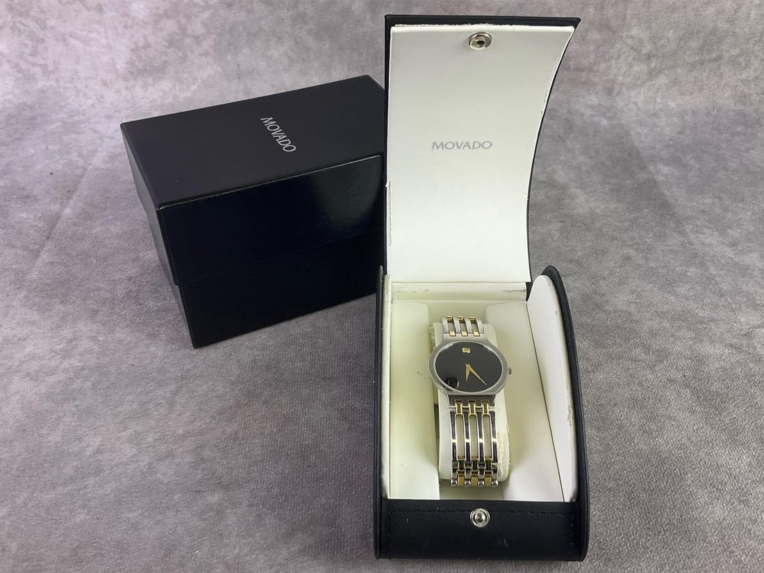 Movado Esperanza Watch: Movado Esperanza two tone PVD watch with black dial. In good condition with original box and untested. Box measures 3.5 inches wide x 3.5 inches tall.