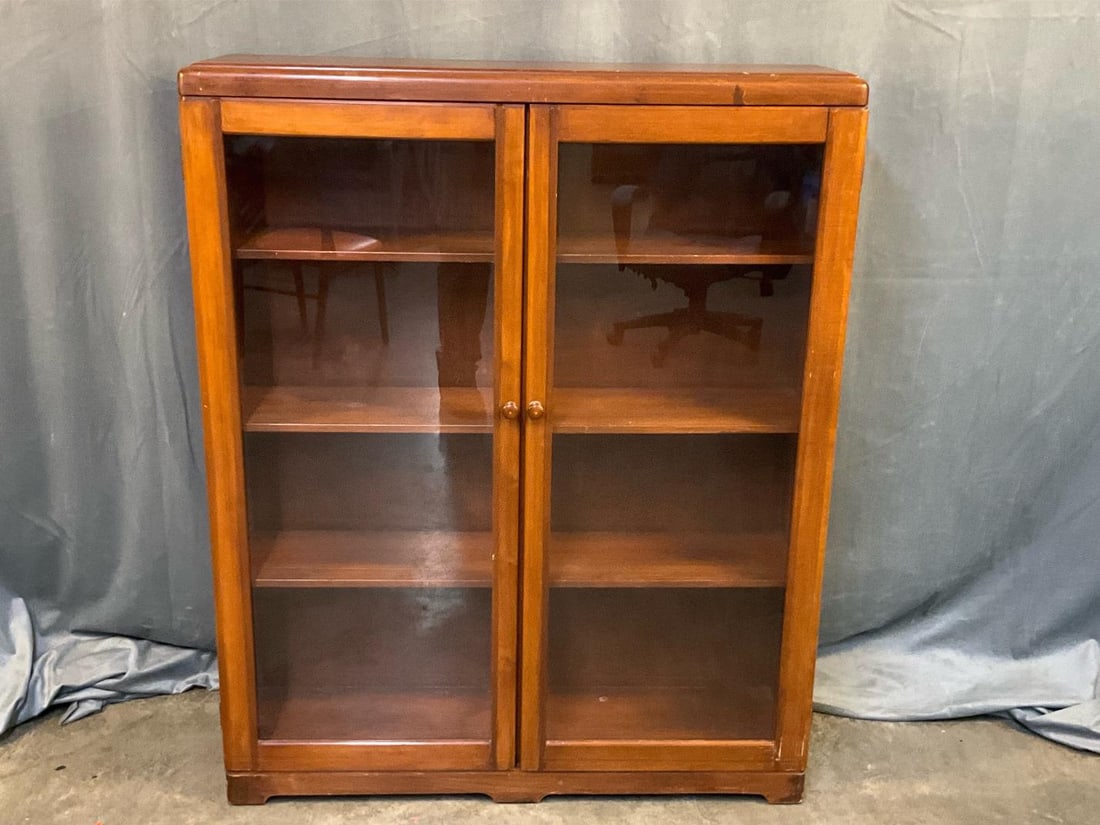 MCM Glass Cabinet: MCM circa 1940's glass bookcase/cabinet with three adjustable shelves. "Peterson Art Furniture Co. Faribault, Minn." paper label to back. Good condition. Measures 39 inches wide x 10.5 x 48 inches