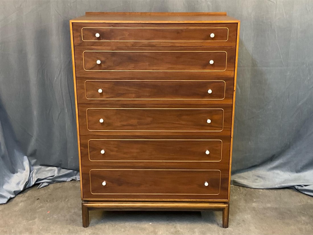 MCM Chest of Drawers: MCM circa 1960's walnut chest of six drawers with porcelain pulls and a plastic tray in the top drawer. Good condition. Measures 33.75 inches wide x 19 x 47 inches tall.