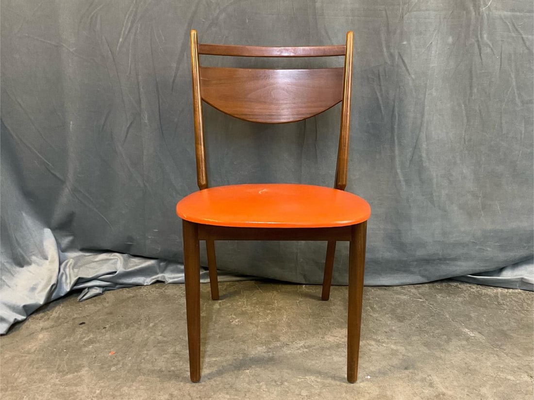 MCM Chair: MCM circa 1960's walnut side chair. "Made by Glenn of California" with paper label on underside of seat. Wobbly with tear to orange vinyl seat. Measures 18.5 inches wide x 20 x 31.75 inches tall.