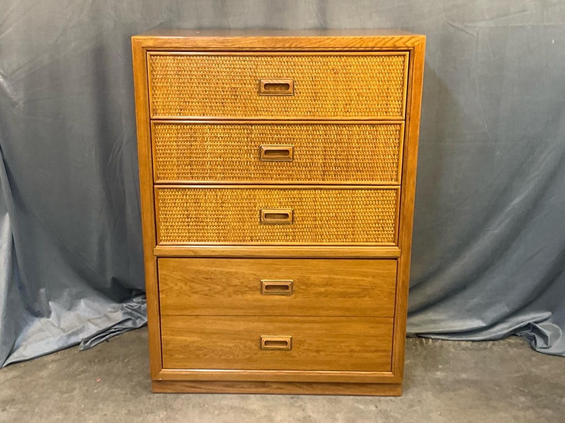 Modern Chest of Drawers: Modern late 20th century circa 1980 chest of five drawers with rattan and oak finish fronts. Manufactured by Dixie Furniture. Good condition. Measures 36 inches wide x 19 x 51 inches tall.