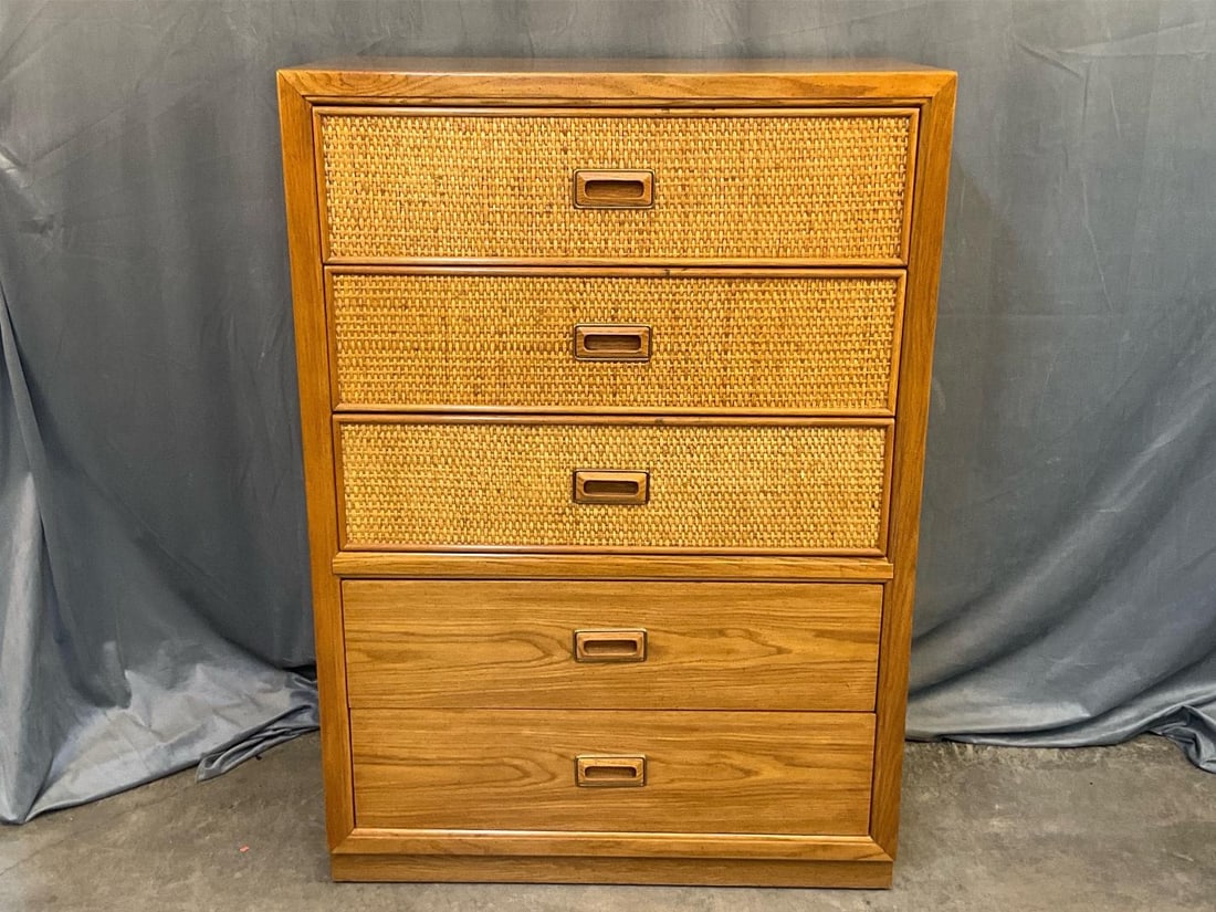 Modern Chest of Drawers: Modern late 20th century circa 1980 chest of five drawers with rattan and oak finish fronts. Manufactured by Dixie Furniture. Good condition. Measures 36 inches wide x 19 x 51 inches tall.