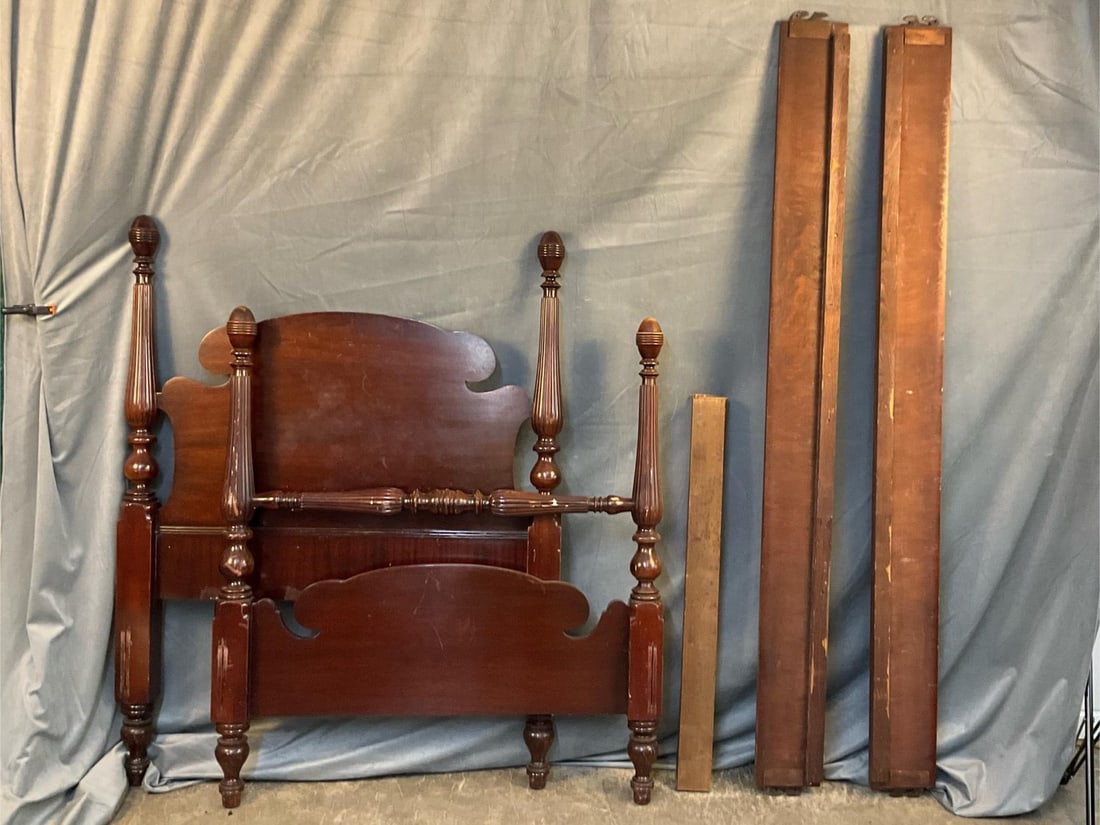 Four Poster Bed: Circa 1920's mahogany four poster bed. Three slats total. Good condition. Measures 38.5 inches wide (pine slats) x 74 inches long (side rails) inner dimensions. Posts on headboard 55 inches tall.