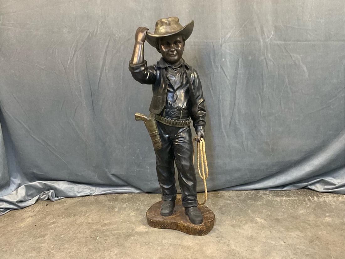 Cowboy Statue: Circa 1960's - 70's ceramic cowboy statue with rope lasso in hand. Good condition. Measures 13 inches wide x 15 x 38 inches tall.