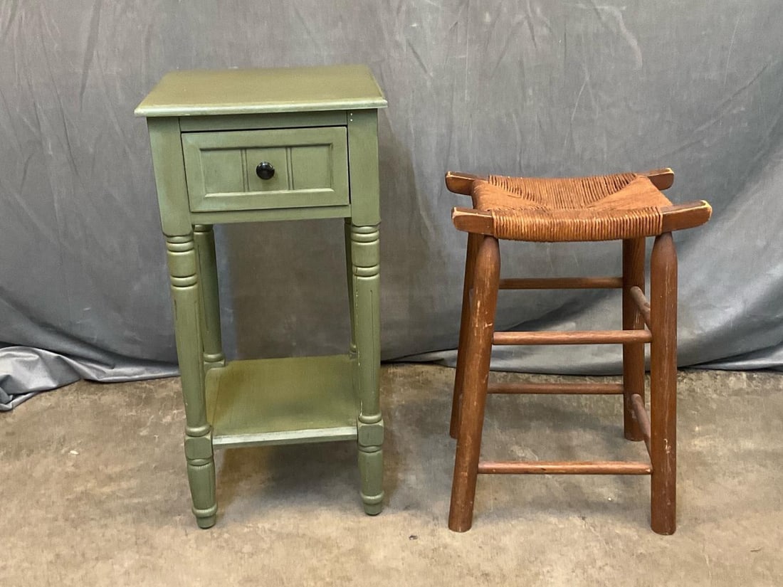 Side Table/Stool: Mid - twentieth century vintage green painted side table with shelf below drawer and turned legs. Crack to front right leg. One pine stool with rush seat with normal wear to finish, good condition.